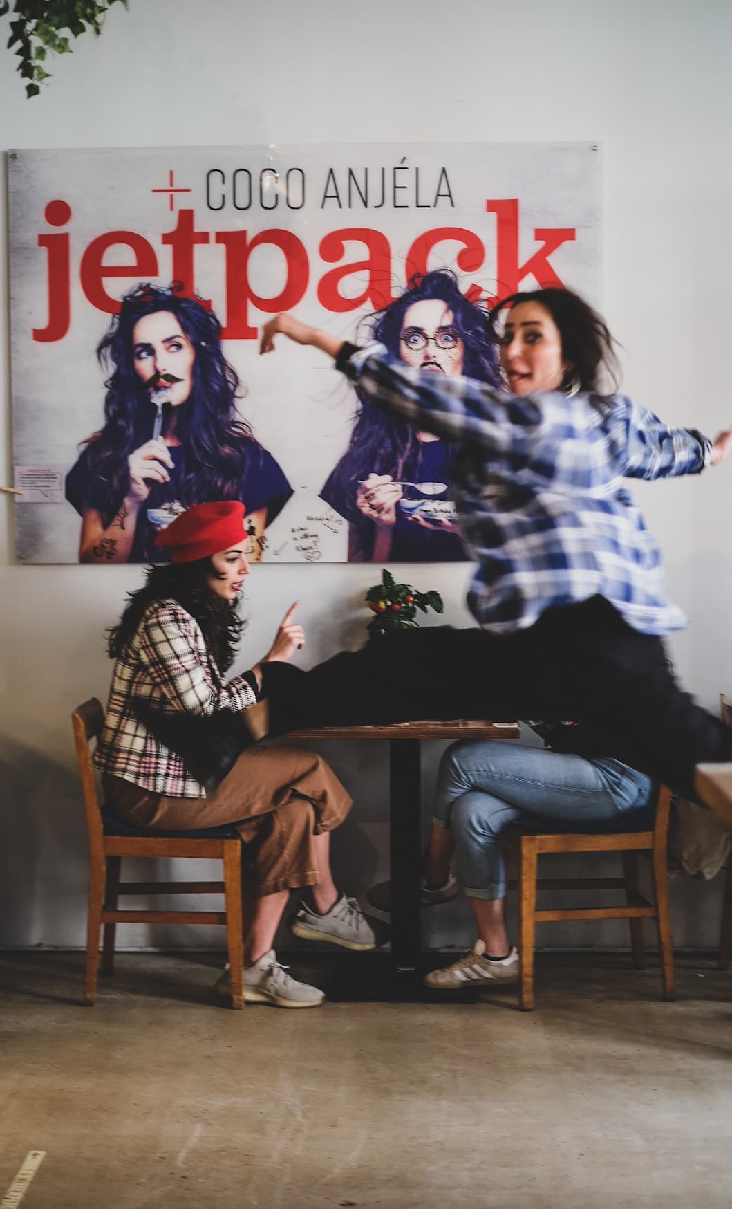 Guests gathered beneath the Coco Anjela Jetpack artwork during a Factory Girl event