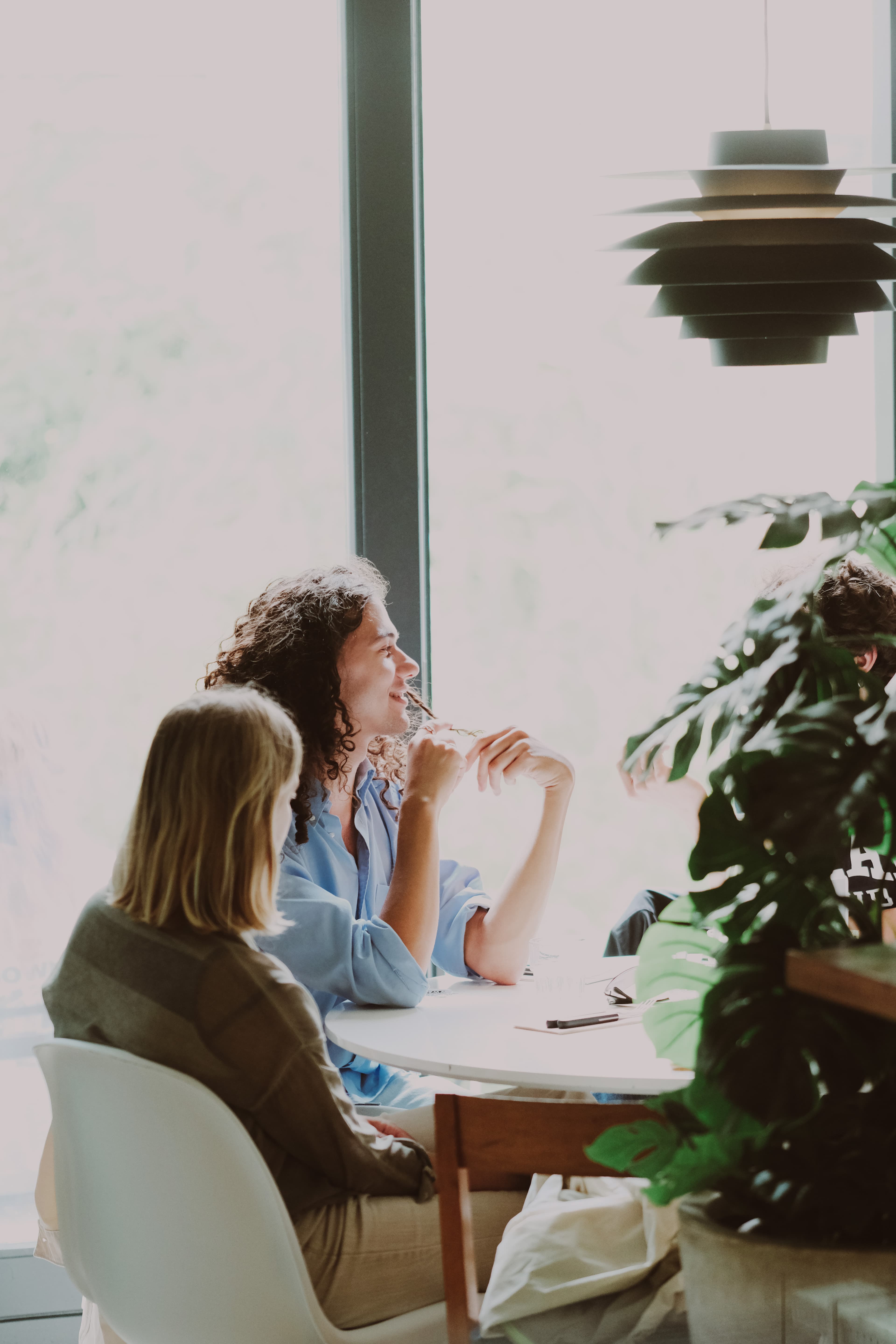 Sunlit table conversation during a daytime Factory Girl gathering