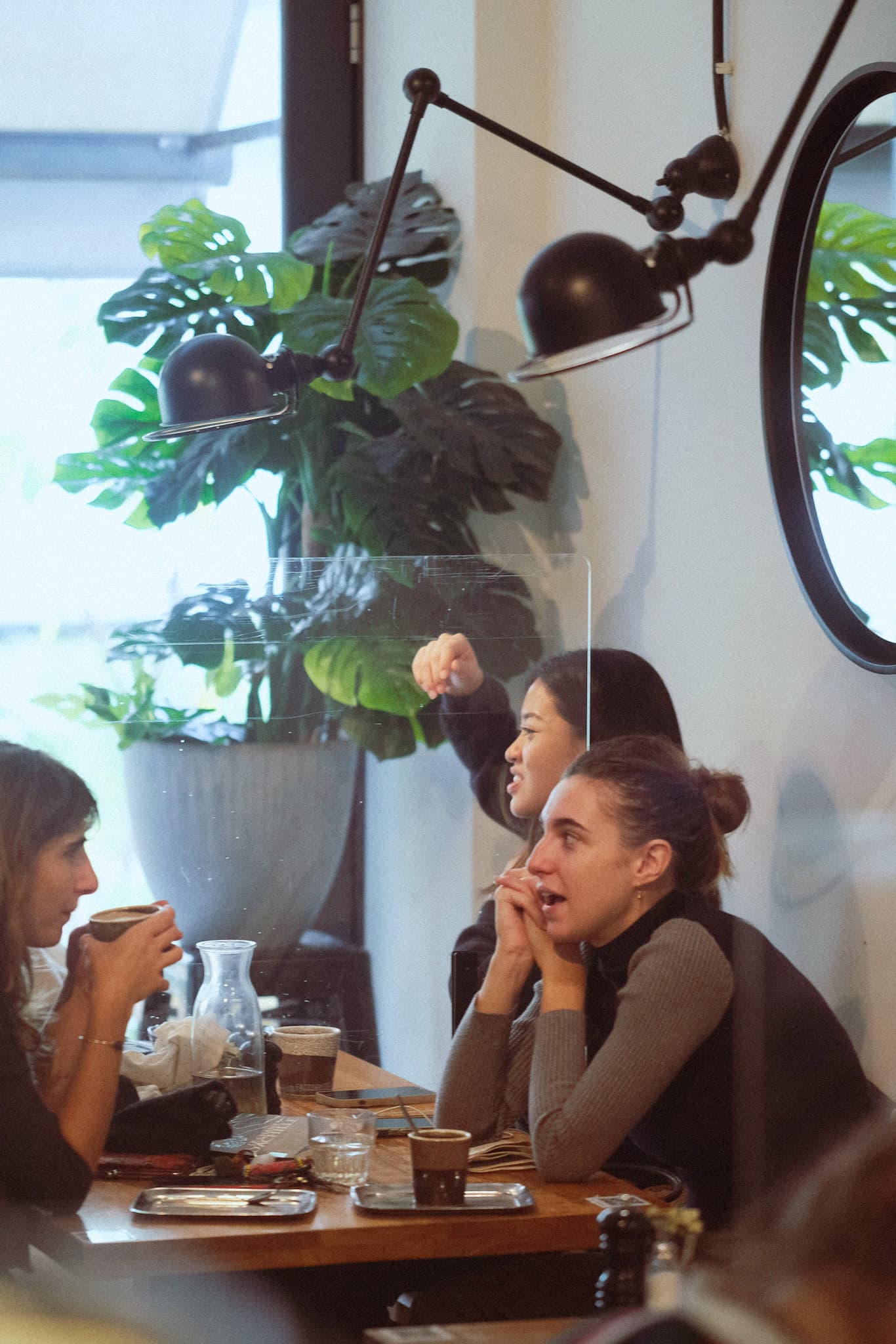 Guests chatting across the table during a relaxed event at Factory Girl